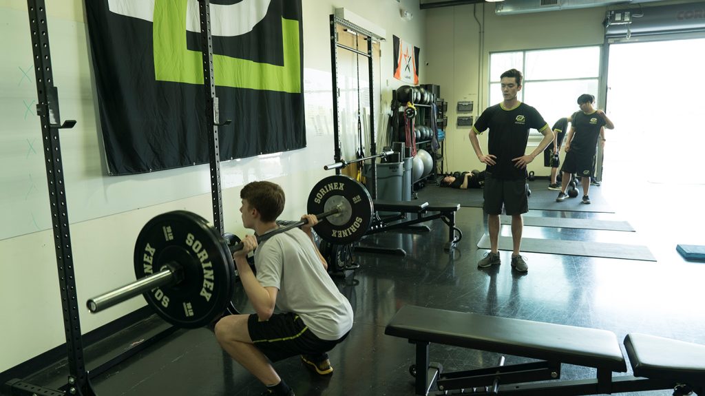 Members working out with weights