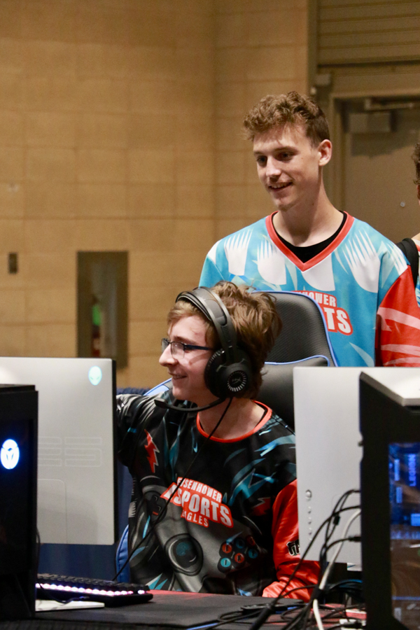 Players stand together, smiling before a match.